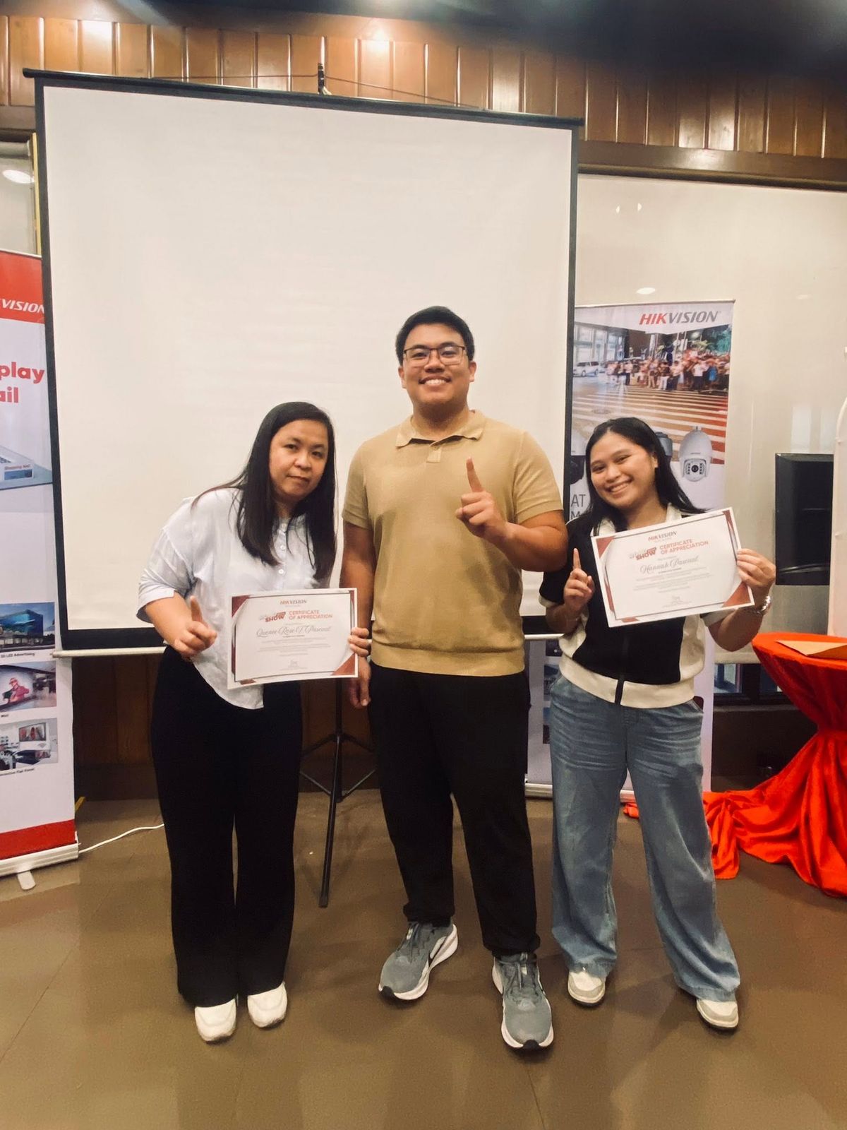 ASMR CCTV Trading team members holding certificates at an industry event