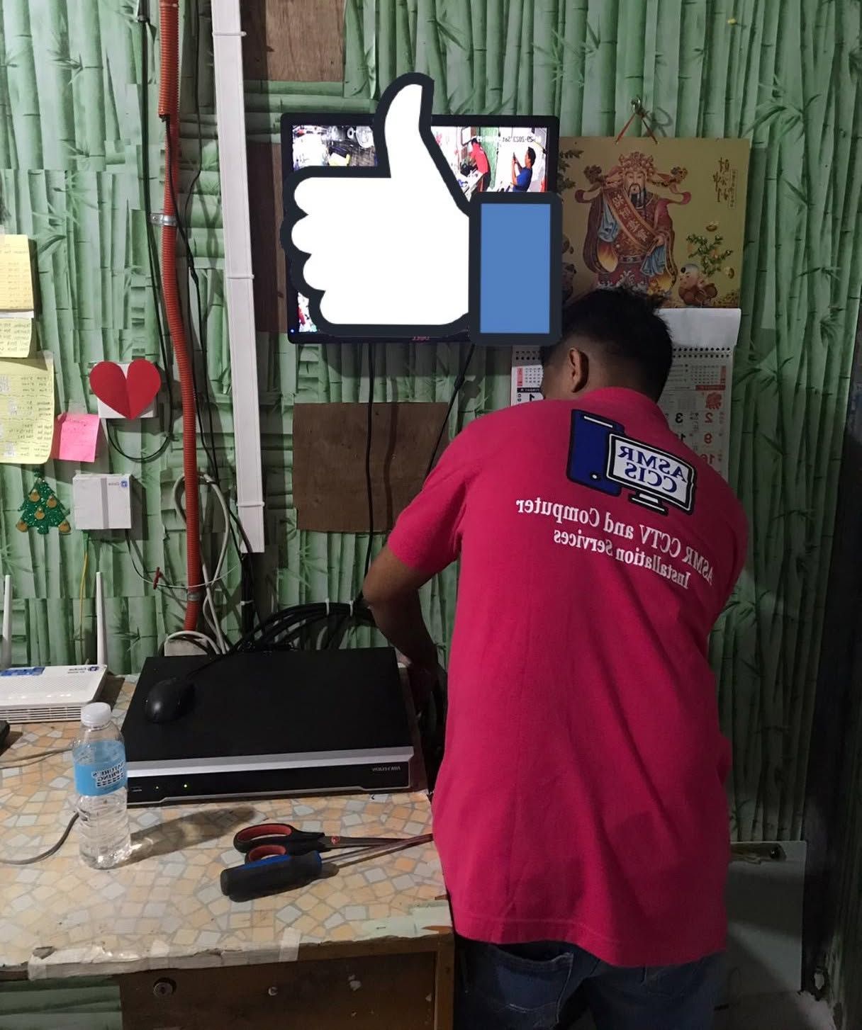 ASMR CCTV technician in branded uniform working on-site